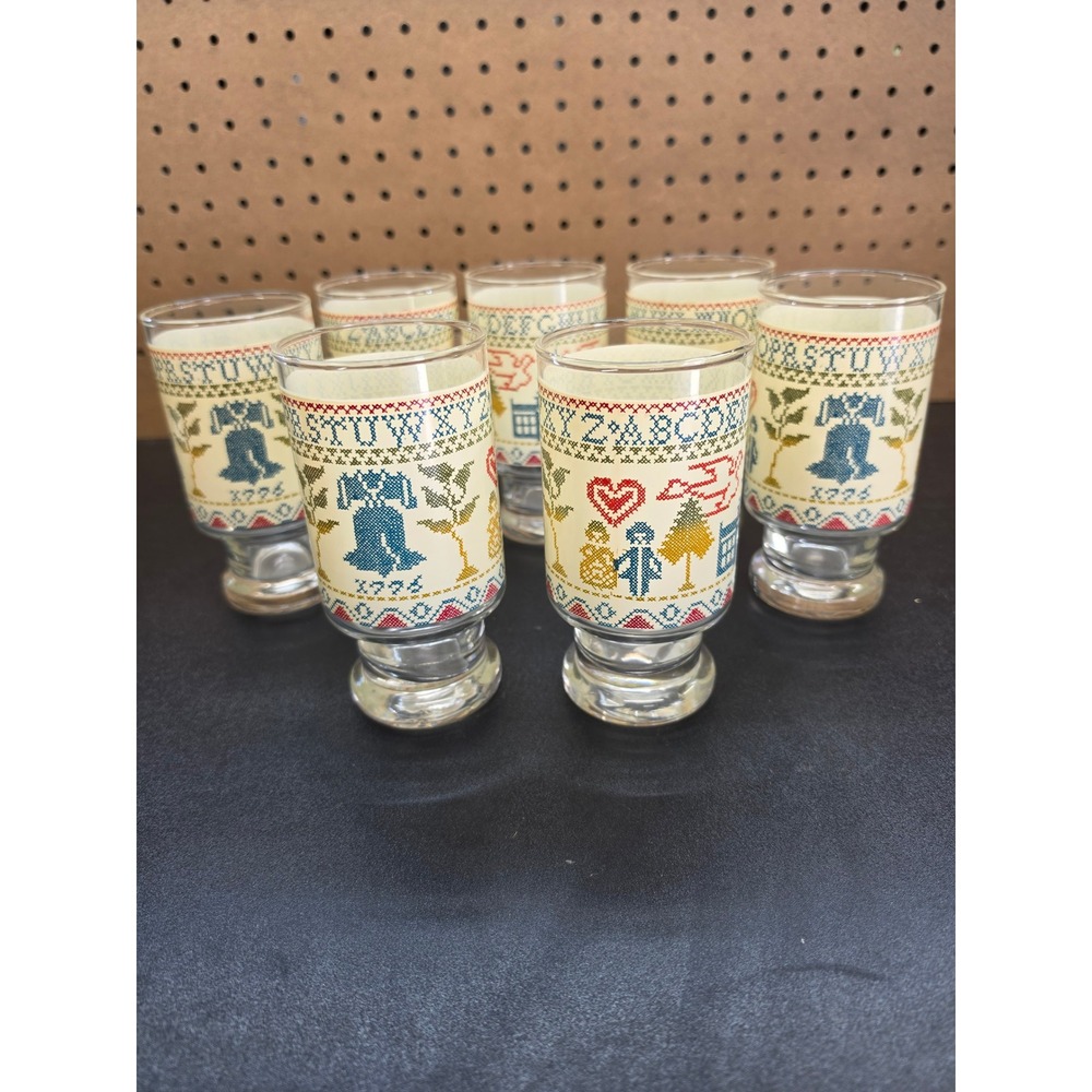 Vintage Set of 7 Colonial Cross Stitch Sampler Footed Glasses 1776 Liberty Bell